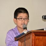 A young representative of the People’s Republic of China gives his performance.