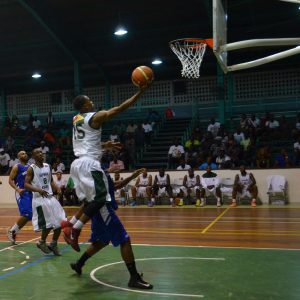 Point guard Shelroy Thomas scores a layup in the 4th quarter against Bermuda at the Cliff Anderson Sports Hall.