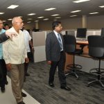  President Donald Ramotar and Finance Minister Dr Ashni Singh on a tour of Qualfon Guyana 111   