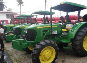 The four tractors handed over to the NDCs on the Essequibo Coast to sustain the Clean Up My Country programme