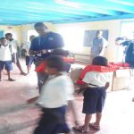 A MARAD officer demonstrating how a lifejacket should be worn.