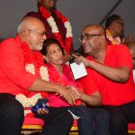President Donald Ramotar, left, with former president, Dr Bharrat Jagdeo, sharing a light moment. At centre is first lady, Deolatchmee Ramotar