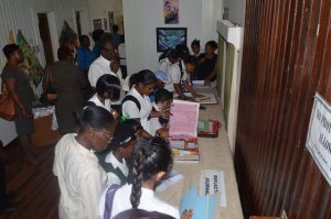 Students and teachers viewing the art pieces 