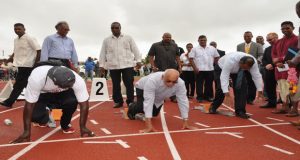 President Donald Ramotar (front row, second from left) challenges Minister of Sport Dr Frank Anthony, (third from left), and others to a race on the synthetic surface of the National Track and Field Centre. (Photo by Delano Williams)
