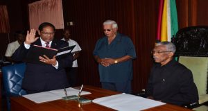 The Honourable Moses Veerasammy Nagamootoo takes the Oath as Prime Minister of Guyana in the presence of His Excellency President David Arthur Granger, yesterday (Adrian Narine photos)