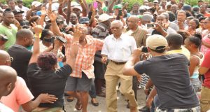 Opposition Leader Brigadier [ret’d) David Granger arrives at the St Sidwell’s Primary School, a polling station, to appease the angry crowd [Delano Williams photos) 