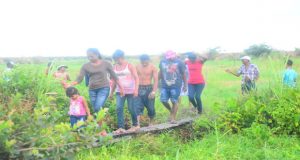 Residents in the backlands at ‘Grassfield,’ Mon Repos, East Coast Demerara, as they seek to acquire plots of land yesterday