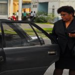 Carol Sooba entering a council vehicle to be taken home