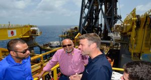 ‘FLASHBACK’: President Donald Ramotar and Minister Robert Persaud listen keenly to an official on board the ExxonMobil’s Deepwater Champion oil rig, during a visit to the drillship last month 