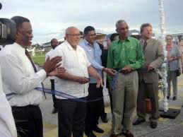 Former President Donald Ramotar, Brian Tiwarie and President David Granger, who was then Opposition Leader, at a ribbon cutting exercise