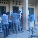  Voters wait in  line at another school on the  Essequibo Coast  