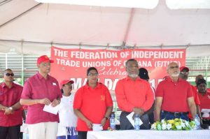 Singing ‘Solidarity Forever’ at the May Day Rally. From left Minister Clement Rohee, PPP/C's Prime Ministerial Candidate Elisabeth Harper, Prime Minister Samuel Hinds and President Donald Ramotar 