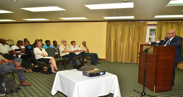 Professor Suresh Narine [at podium) engages stakeholders at the CGX corporate presentation held at Cara Lodge last week