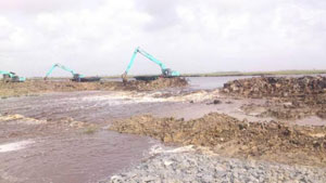 The cut made in the vicinity of the head regulator of the Hope Canal project to release water