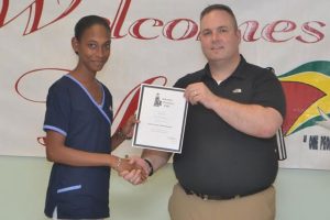  Dan Batsie, head of the Atlantic Emergency Medical Service, presenting a certificate to one of the participants 