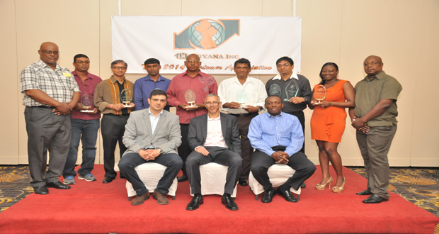 Awardees pose for a photo with Minister Gaskin and officials of TGI.