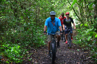 Some of the guests being led by Captain Gerald Gouveia as they go mountain-biking [Photos by Adrian Narine) 