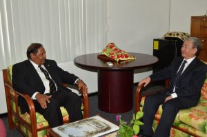 Prime Minister, Moses Nagamootoo and Chinese Ambassador to Guyana,  H.E. Zhang Limin engaged in discussions during the courtesy call