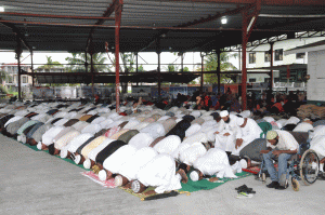 Muslim worshippers participating in prayers at the Muslim Youth League on Woolford Avenue, Georgetown [Delano Williams photo)