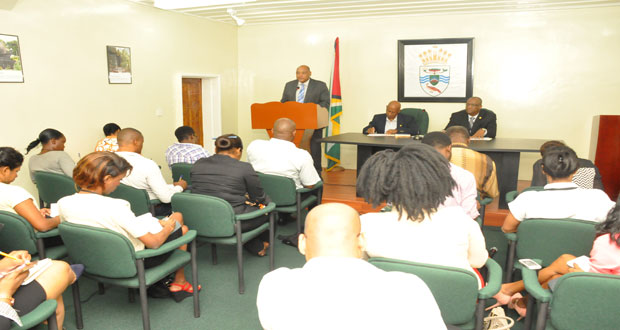 Governance Minister, Raphael Trotman addresses the press corps at the post-cabinet press briefing. Seated at the table are Minister of State, Joseph Harmon [at right), and Director of Public Information (designate) in the Office of the Prime Minister, Mark Archer