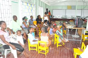Affected residents and their children being facilitated at the Selman Fraser Nursery School due to severe flooding in the area.