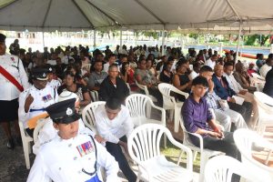 Family members and other associates of fallen police ranks listen attentively as the Top Cop addresses them (Photos by Samuel Maughn)  