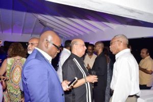 President David Granger mingling with Sir Ronald Sanders, Senior Research Fellow at the Ubniversity of London’s Institute of Commonwealth Studies and other guests during the reception