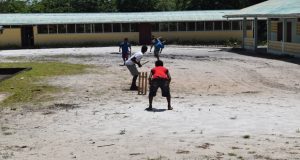 Some of the youngsters engage in a game of cricket before they officially settle in 