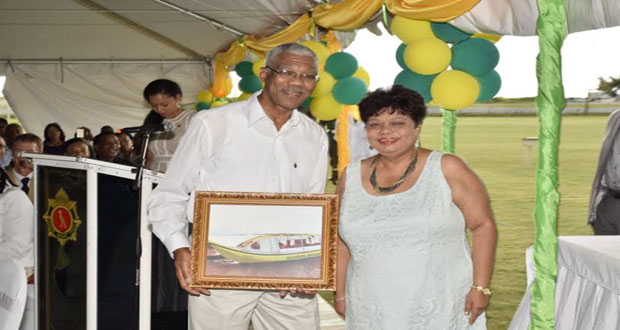 President David Granger with Minister of Social Cohesion Amna Ally, with a picture of the boat foe school children