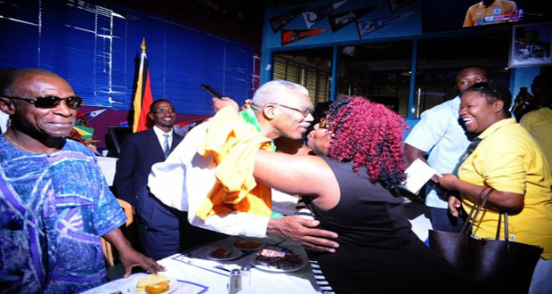 President David Granger being greeted by one of his supporters at Bubbas Sports Bar [Barbados Daily)