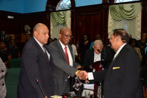  Finance Minister Winston Jordan with Prime Minister Moses Nagamootoo, at right, and Minister of Governance Minister Raphael Trotman at Parliament yesterday 