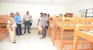 Director of Sport Christopher Jones and Senior Superintendent Maxine Graham join Police Commissioner Persaud, Hicken and Fowler on a tour of one of the camp dorms at Madewini, Timehri where the children stayed 