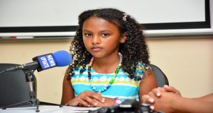 Young author, Anaya Lee Willabus interacts with the press  