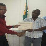 Runner-up best student, Ray Marcurius (left) receiving his certificate from O/C 2 Jessemy  