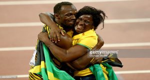 Usain Bolt of Jamaica celebrates with mother Jennifer Bolt after winning gold in the Men's 100 metres.