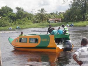 President David Granger and First Lady Sandra Granger take a ride on the new boat with  schoolchildren 