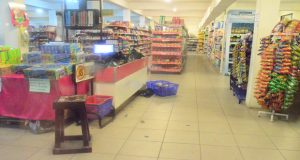 A basket on the floor of the supermarket which was left by a traumatised worker DSC 0084 The security guard is one of the first line of defense for the supermarket DSC 0103 The owner of the supermarket negotiating with police ranks