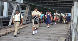 Students from the Berbice High and Multilateral Schools making their way to take advantage of the free boat ride home yesterday  