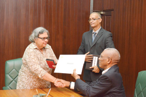Bibi Shadick collects her letter of instrument of office from President David Granger