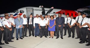 President David Granger stands in front of the new Beechcraft 1900D with ministers of government, CEO Correia Group of Companies, Michael Correia Jr., aircraft pilots and engineers (Delano Williams photos) 