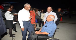 President David Granger listens attentively to CEO Ogle International Airport Anthony Mekdeci (wheel chaired)  