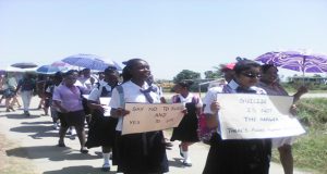Students carrying the anti-suicide message during the march on Thursday