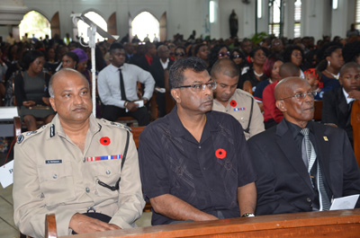 Police Commissioner Seelall Persaud, Public Security Minister Khemraj Ramjattan, and Georgetown Mayor Hamilton Green at the Brickdam Cathedral Service [Delano Williams photo)