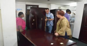 PPP/C Chief Whip Gail Teixeira and PPP/C MP Gillian Burton-Persaud assisting in the removal of the furniture from the Hadfield Street building to the new location
