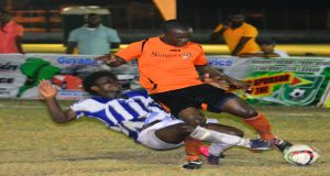 Slingerz FC’s Anthony Harding rides a tackle to remain in possession of the ball during his side’s 5-0 win over GFC.
