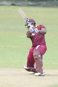Andre Russell square-drives during his innings of 89.