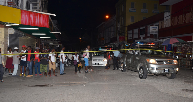 Police cordoned off the America Street area following the daring robbery Tuesday evening [Delano Williams photo)