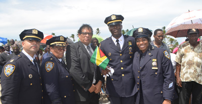 Mr Carl Bowen, Brand Manager of Fly Jamaica, with Guyanese of the NYPD who travelled to Guyana for the funeral of their colleague, Randolph Holder. Fly Jamaica brought home the body of Holder and also provided first-class tickets for Mr. and Mrs. Holder [father and step-mother) of the deceased and for the NYPD pall-bearers. The airline also provided discounted tickets for other family members and NYPD officers (Cullen Bess-Nelson photo) 