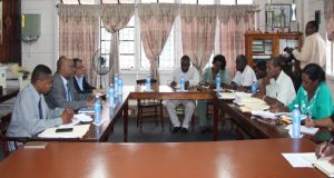 Minister of State Joseph Harmon in discussion with members and representatives of the GPSU 