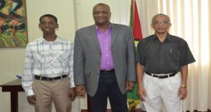 From left: Joel Tucker, Minister of State Joseph Harmon and Peter Assing 